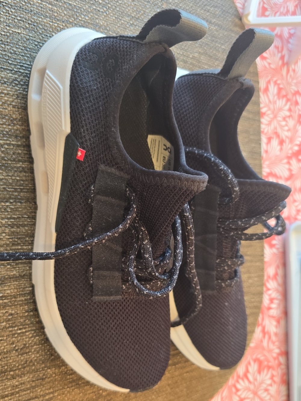 On Running sneaker in black with red logo